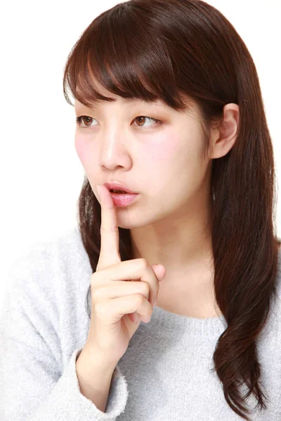 Young Japanese woman whith silence gestures — Stock Photo, Image