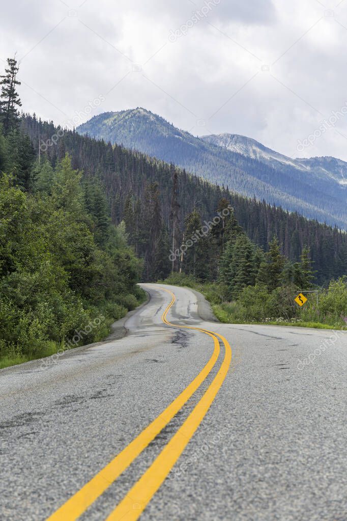road through Canadian natural parks, asphalt with yellow lines