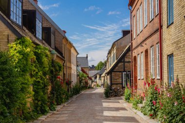 A cosy cobblestone street with half-timbered houses in the old parts of Lund