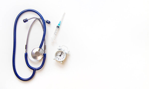 stethoscope and syringe isolate on a white background. Selective focus.