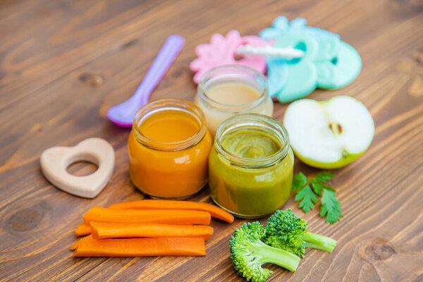 Baby food. Mashed vegetables and fruits in jars. Selective focus.
