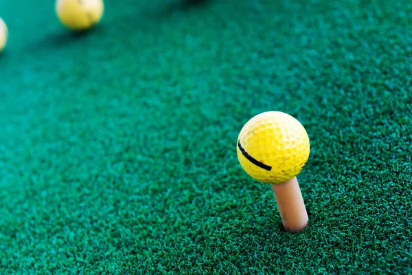 Golf training balls on green grass.