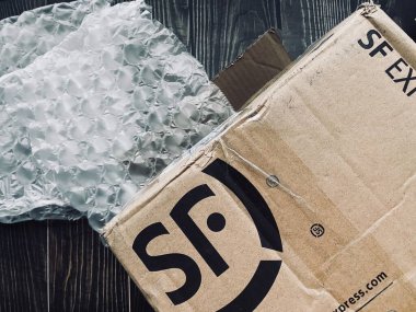 Shanghai - China - February 25, 2020: SF express delivery boxes ready to delivery. SF Express is a Chinese delivery company based in Shenzhen. 
