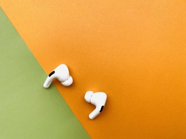 Shanghai/China - February 26, 2020: Newest AirPods Pro on colorful paper with copy space. 