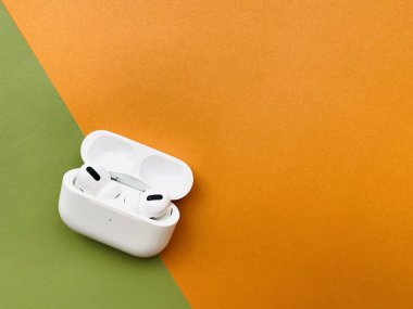Shanghai/China - February 26, 2020: Newest AirPods Pro on colorful paper with copy space. 