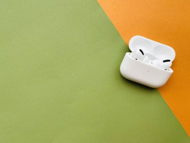 Shanghai/China - February 26, 2020: Newest AirPods Pro on colorful paper with copy space. 