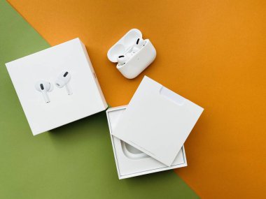 Shanghai/China - February 26, 2020: Newest AirPods Pro on colorful paper with copy space. 