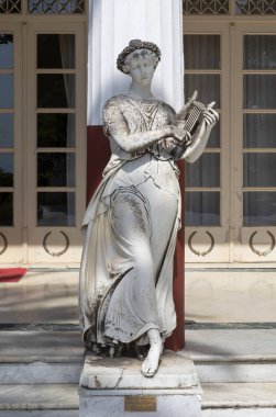 Marble statue of Terpsichore, goddess of dance and chorus in the Courtyard of the Muses, Achilleion Palace, Corfu, Greece clipart