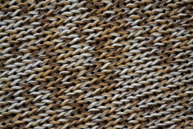 Koyu kahverengi tonlarda örülmüş doku karışımı. Moda konsepti.