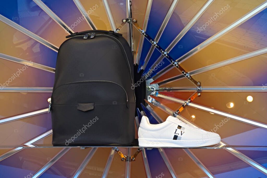 Ikebukuro, Tokyo / Japan - March 6, 2019: Louis Vuitton men's backpack bag and sneakers in the window display of their East exit Ikebukuro shop.