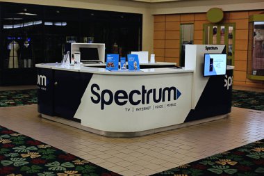 Honolulu, Hawaii - April 25, 2020: Spectrum cable company kiosk in the Kalaha Mall in Waialae, Oahu. clipart