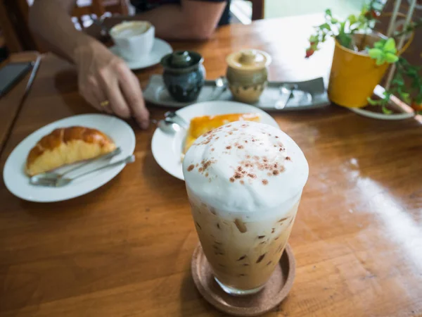 ice coffee and bakery on wood table