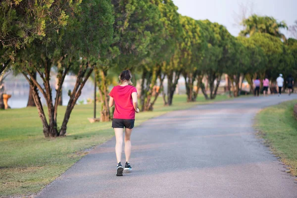 woman jogging at the garden in the evening