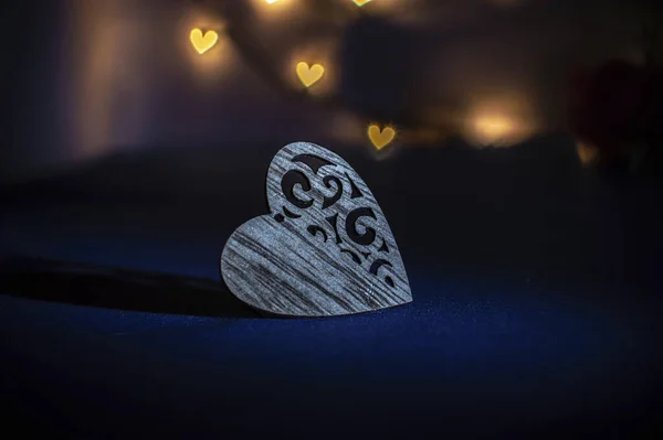 romantic heart made of wood on a blue background