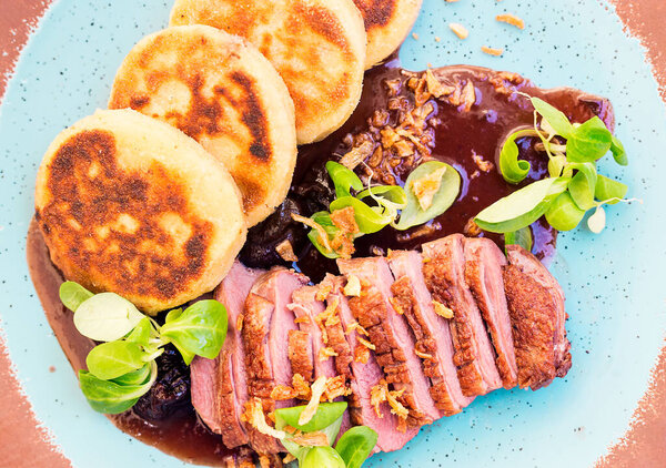 Roast duck with potato pancakes and plum sauce