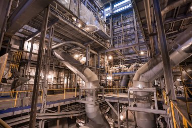 Interior of coal power plant. Pipelines in boiler room clipart