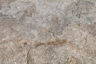 Güzel kahverengi ve bronzlaşmış mermer kaya yüzeyi.