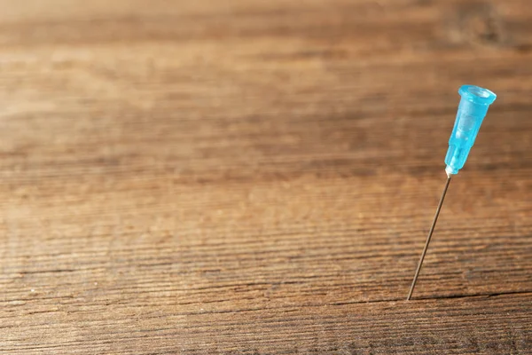 Medical needle from a syringe close-up