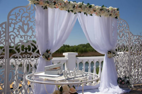 Wedding arch, visiting ceremony on the river bank