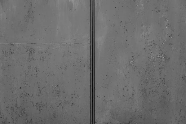 The concrete texture, wall, with cracks and scratches can be used as a background