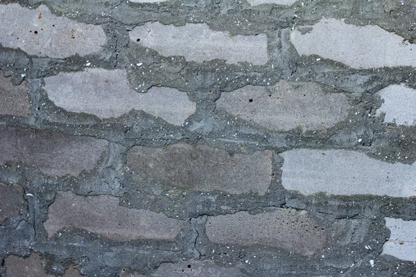 갈라진 과긁힌 벽돌의 벽등을 배경으로 수있다 — 스톡 사진