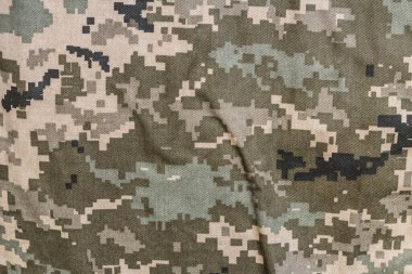 Closeup of military uniform surface. clipart