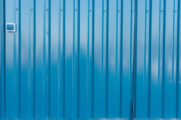 Colored sheet metal profile, blue metal sheets, background