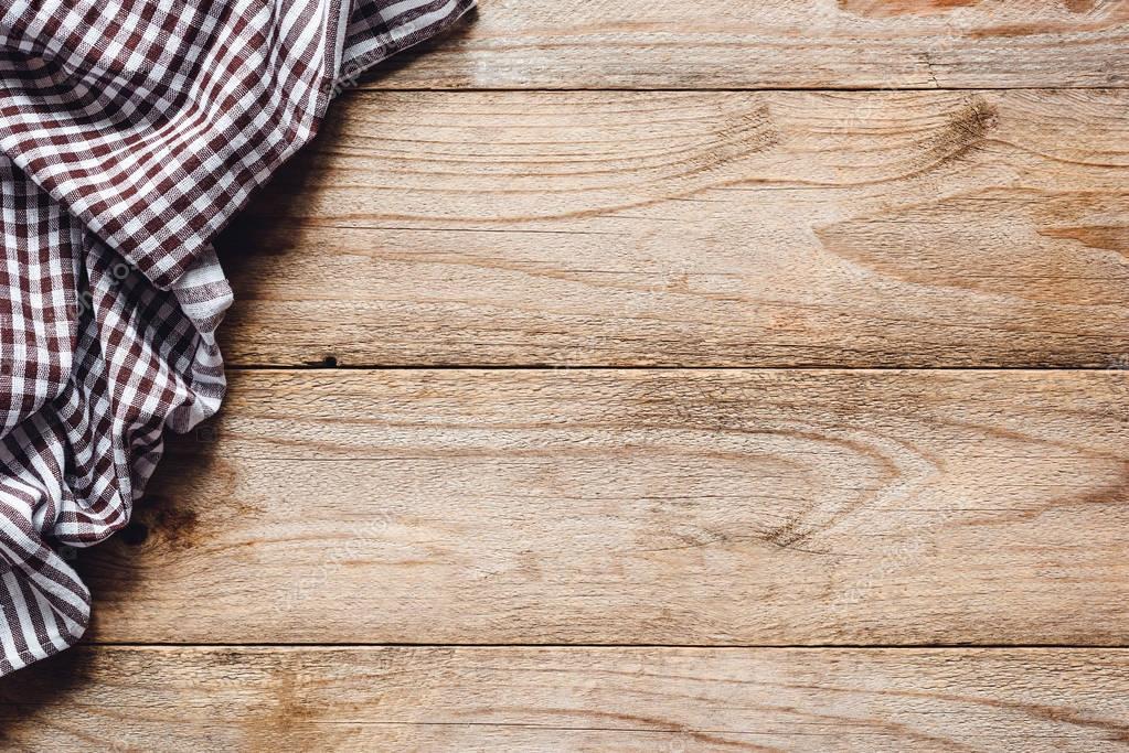 Wooden table background with textile. Food background 