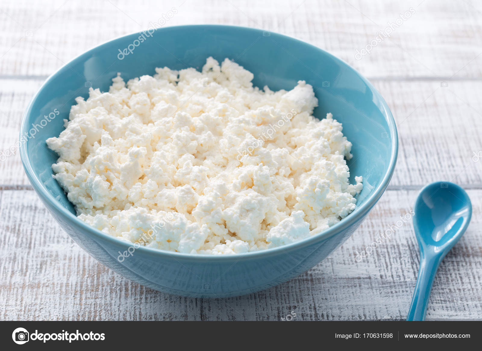 Organic Farming Cottage Cheese Or Curd Cheese In A Blue Bowl