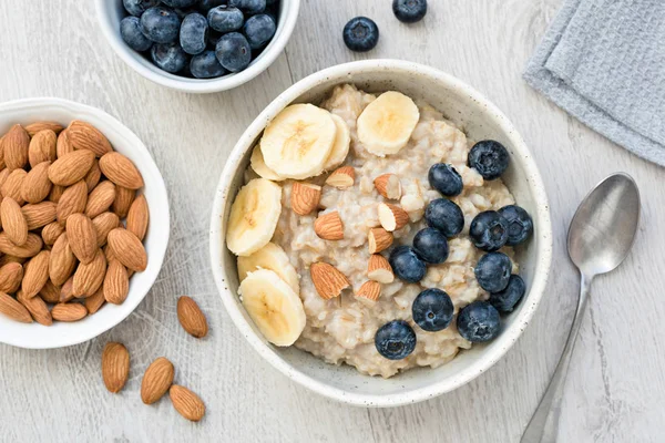 Oatmeal Porridge with Banana, Blueberry and Almonds — Stock Photo, Image