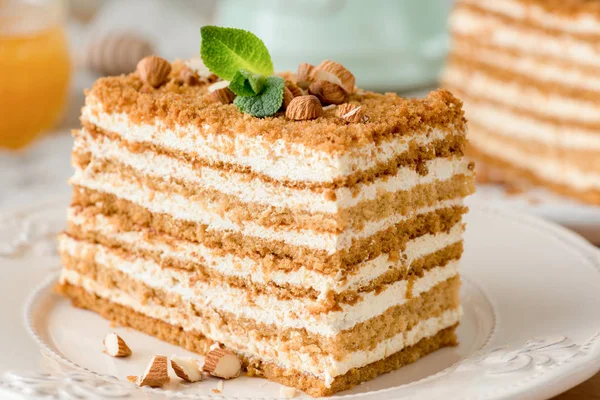 Honey cake Medovik on white plate