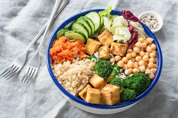 Nourishing buddha bowl with tofu, quinoa and vegetables