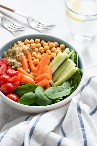 Healthy buddha bowl, salad bowl or nourishing bowl with vegetables, chickpea and quinoa