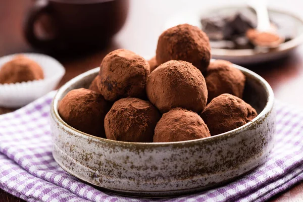 Chocolate truffles in ceramic dish — Stock Photo, Image