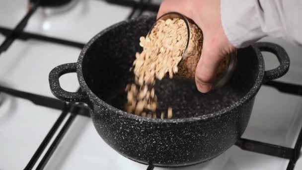 Oatmeal Porridge Healthy Breakfast Concept Male Hand Add Rolled Oats — Stock Video