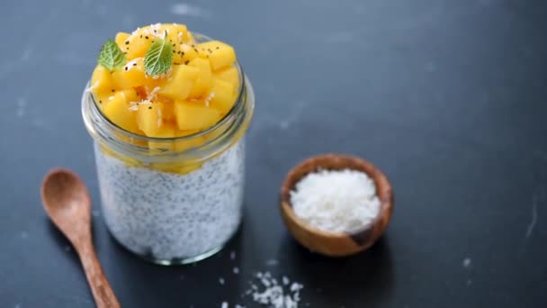 Mango Chia Pudding Jar Rotating Black Marble Table Clean Eating — Stock Video