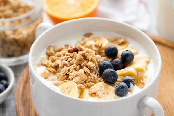 Granola with fruits and yogurt in bowl