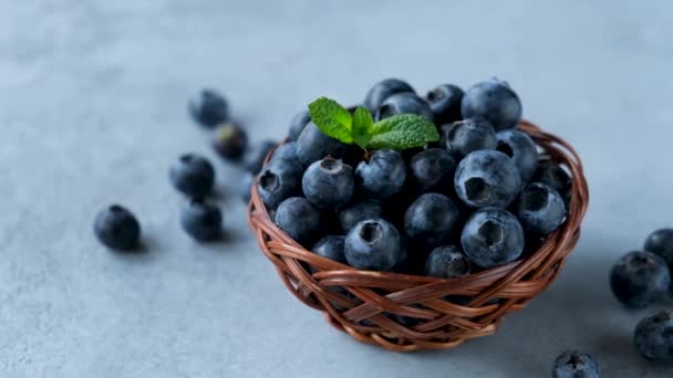Freshly Picked Blueberries Basket Concrete Table Background Closeup View Footage — Stock Video