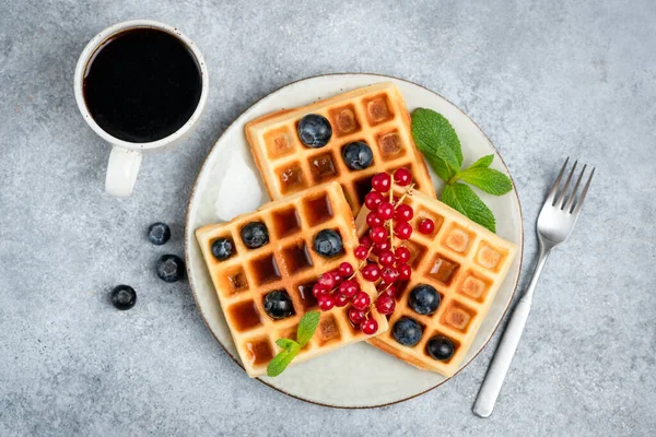 Waffles with berries and cup of coffee — Stock Photo, Image