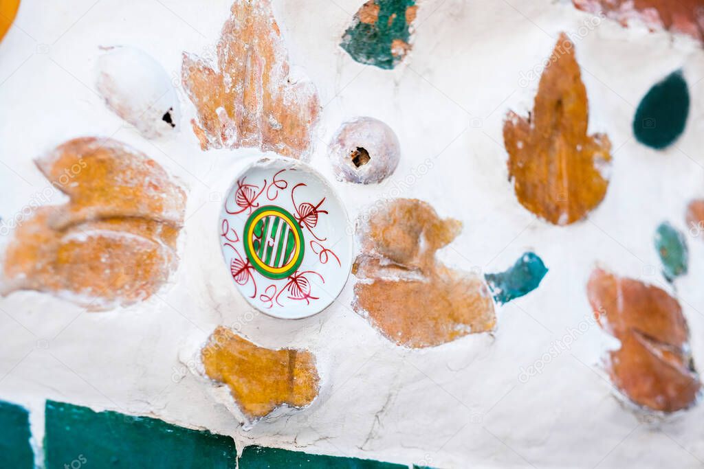 The architecture resembled a dish on the wall of Pra Arun temple Surrounding Phra Prang, Wat Arun, Bangkok. Thailand.