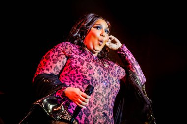 AMSTERDAM, NETHERLANDS - NOVEMBER 18, 2019: Amazing Lizzo performing at show at AFAS Live concert hall. clipart