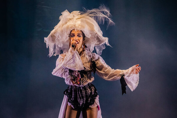 AMSTERDAM, NETHERLANDS - DECEMBER 3, 2019: FKA twigs singing while show on stage at Royal Theatre Carre.
