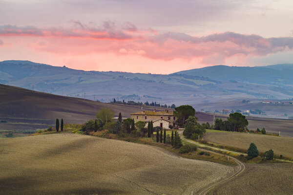 beautiful, colorful clouds during sunset over Tuscany
