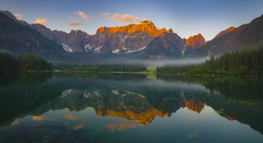 panorama of mountain lake in the morning in the Julian Alps in I clipart