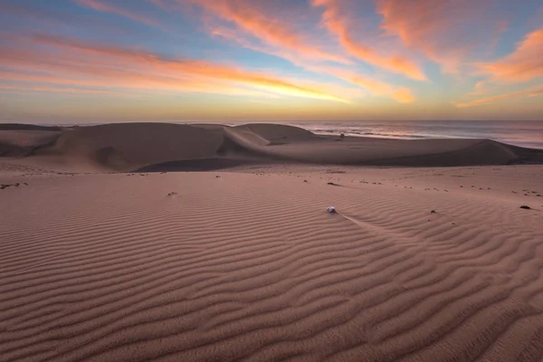 Famous natural park Maspalomas dunes in Gran Canaria at sunrise,