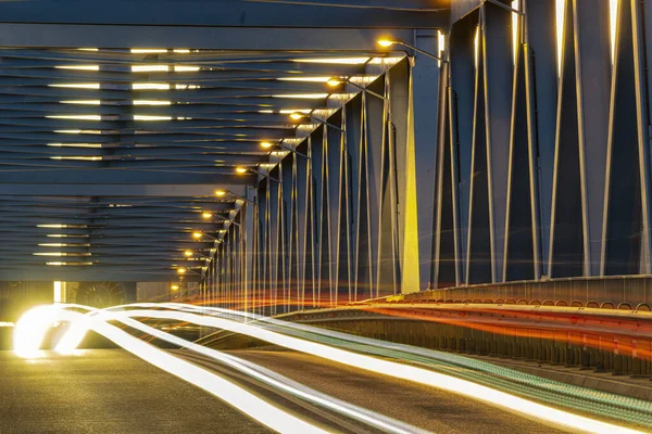 Night traffic lights inside of steel bridge — Stock Photo, Image