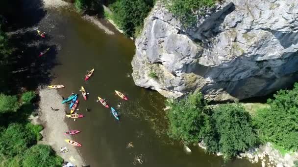 Aerial View People Jumping Water High Rock Cliff Group Kayakers — Stock Video