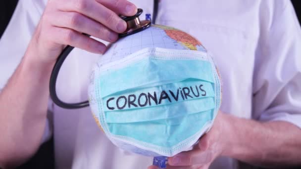 Coronavirus Epidemic Concept World Globus Green Medical Mask Doctor Using — Stock Video