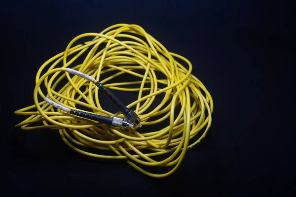 FC FC CONNECTOR YELLOW OFC PATCH CORD FERRULE CONNECTOR IN BLACK BACKGROUND TELE COMMUNICATION