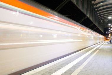 Darmstadt, Hessen, Germany - 16 Jan 2020: train in motion at main station, platform view level at night